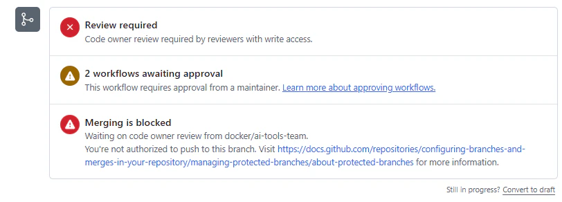 提出PRのマージステータス: Review required(コードオーナーのレビュー必須)、2 workflows awaiting approval(ワークフローの実行にメンテナー承認が必要)、Merging is blocked(docker/ai-tools-teamのレビュー待ち)