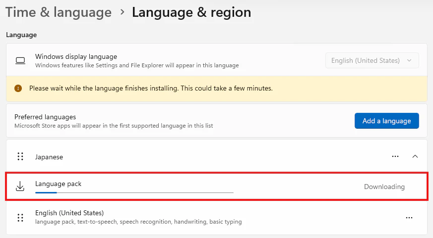 Language and region画面でJapanese language packのダウンロード進行状況を確認する画面