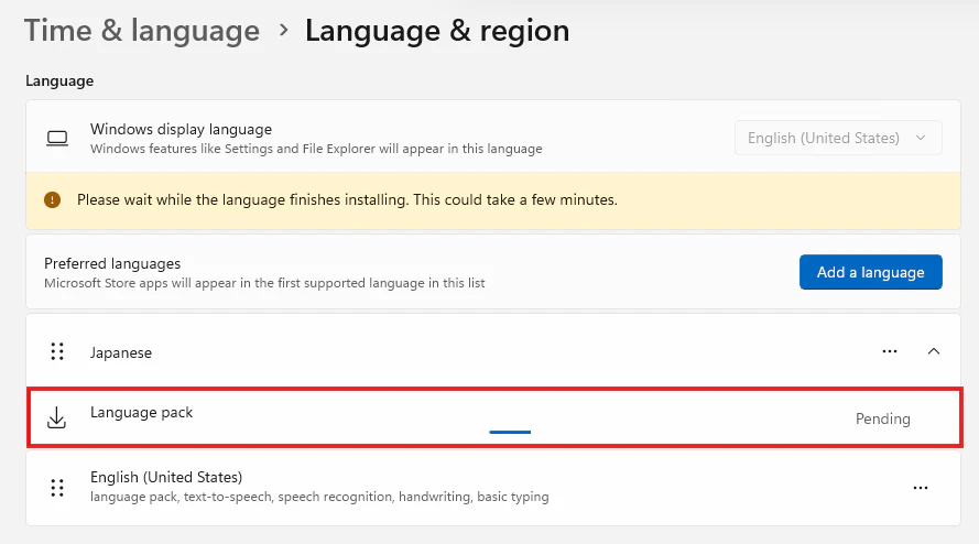 Language and region画面でJapanese language packのインストール待ちを確認する画面
