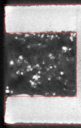 slice at z = 4.00 mm just below the crown of the 4 mm hole: particles hang into the hole from the do